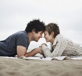 Couple face to face on beach